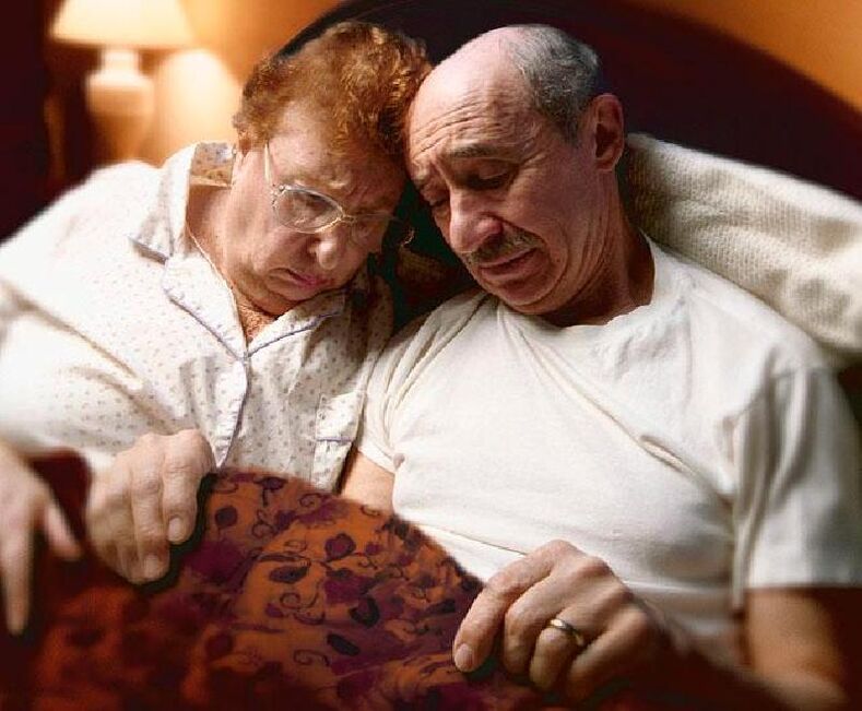 elderly pair in bed